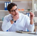 Doctor optician prescribing holding optical glasses