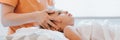 Doctor osteopath hands does physiological and emotional therapy for eight year old kid girl. pediatric osteopathy treatment sessio