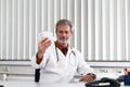 Doctor overstressed at his office desk