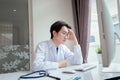 Doctor overworked with computer on desk clinic health care for pateint technology help support