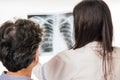 Doctor and patient analyzing chest radiography Royalty Free Stock Photo