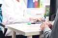 Doctor and patient in appointment, visit or meeting in hospital Royalty Free Stock Photo