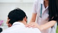 Doctor comforting patient at consulting room Royalty Free Stock Photo