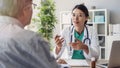 Doctor and patient are discussing at clinic Royalty Free Stock Photo