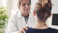 Doctor and patient are discussing at clinic Royalty Free Stock Photo