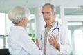 doctor and patient discussing at clinic Royalty Free Stock Photo