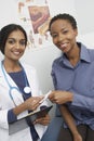 Doctor And Patient Holding Prescription Royalty Free Stock Photo