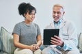 Doctor, patient and man with tablet for consultation, checkup or health results in home visit. Healthcare, technology Royalty Free Stock Photo