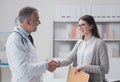 Doctor and patient shaking hands Royalty Free Stock Photo