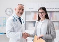 Doctor and patient shaking hands Royalty Free Stock Photo