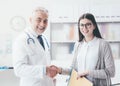 Doctor and patient shaking hands Royalty Free Stock Photo