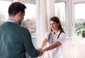 Doctor and patient shaking hands Royalty Free Stock Photo