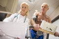 Doctor With Patient On Treadmill