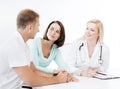 Doctor with patients in cabinet