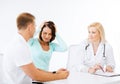 Doctor with patients in hospital