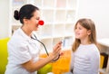 Doctor pediatrician with clown nose and happy child patient Royalty Free Stock Photo