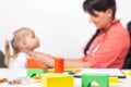 Doctor pediatrician examines the throat of a little girl. Copy space for text