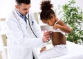 Doctor pediatrician examining cute african girl Royalty Free Stock Photo