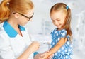 Doctor a pediatrician makes child vaccinated