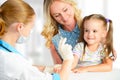 Doctor pediatrician makes child vaccination Royalty Free Stock Photo