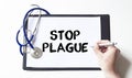 Doctor with pen and card with word STOP PLAGUE, Medical concept