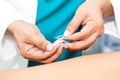 Doctor performing acupuncture on a male patient