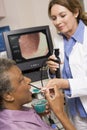 Doctor Performing Laryngoscopy On Patient Royalty Free Stock Photo