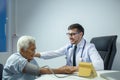 Doctor performs physical examination of the elderly