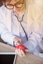 Doctor with Heart Disease Checker Royalty Free Stock Photo