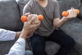 Doctor physiotherapist treating arm pain patient doing physical therapy exercises with his therapist in clinic - sport physical Royalty Free Stock Photo