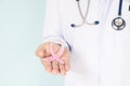 Doctor with pink ribbon concept. Royalty Free Stock Photo