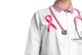 Doctor with pink ribbon and stethoscope on background, closeup. Breast cancer awareness Royalty Free Stock Photo