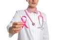 Doctor with pink ribbon and stethoscope on background, closeup. Breast cancer awareness Royalty Free Stock Photo