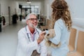 Doctor playing with his little patient at pediatrics.