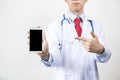 Doctor pointing at blank smartphone for advertising technology and application in white background.