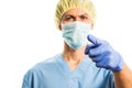 Doctor points finger in medical clothes with rubber gloves and a mask , portrait on a white background