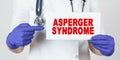 The doctor points his finger at a sign that says - ASPERGER SYNDROME