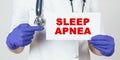 The doctor points his finger at a sign that says - SLEEP APNEA Royalty Free Stock Photo