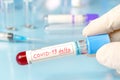 Doctor with a positive blood sample for the new variant detected of the coronavirus strain called covid DELTA. Research of new