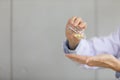 Doctor pouring capsule of vitamin or medicine from small glass bottle to his hand Royalty Free Stock Photo