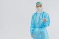 Doctor PPE uniform holding coronavirus covid-19 vaccine bottle on hand Royalty Free Stock Photo