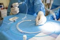 Doctor preparing instrument for vein surgery Royalty Free Stock Photo