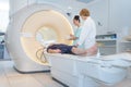 Doctor preparing patient for mri scan in hospital Royalty Free Stock Photo