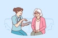 Doctor prescribes medication to elderly female patient and holds pills with smtwtfs letters