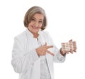 Doctor prescribes pills - elder woman isolated on white background