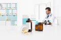 Doctor prescribes prescription sitting at the desk office with pills, drugs and medicine bottles, medical care concept, web banner Royalty Free Stock Photo