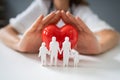 Doctor Protecting Red Heart With Family Figure Royalty Free Stock Photo