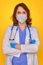 A doctor in protective gloves with a stethoscope stands with his arms crossed, close-up Royalty Free Stock Photo