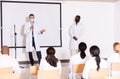 Doctor in protective mask speaking from conference room stage Royalty Free Stock Photo