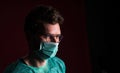 Doctor in protective medical mask. Nurse in glasses prepare for surgery. Medic against for pandemic and flu season